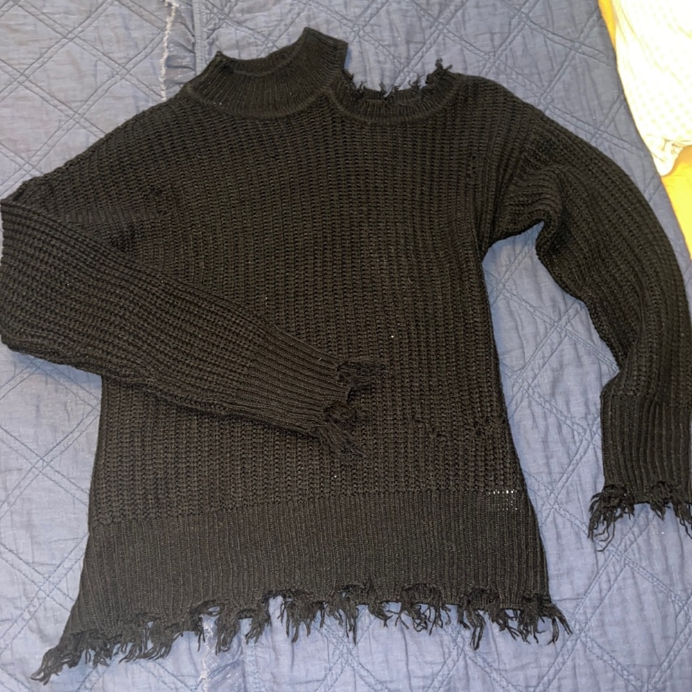 Black sweater with cut out shoulder and fringe